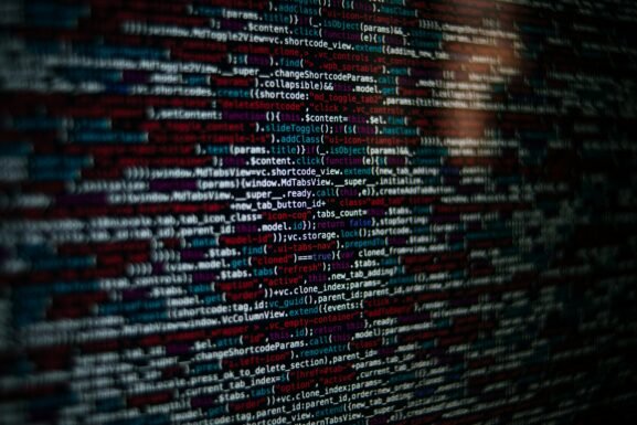 Detailed image of computer source code displayed on a screen, showcasing web development elements.